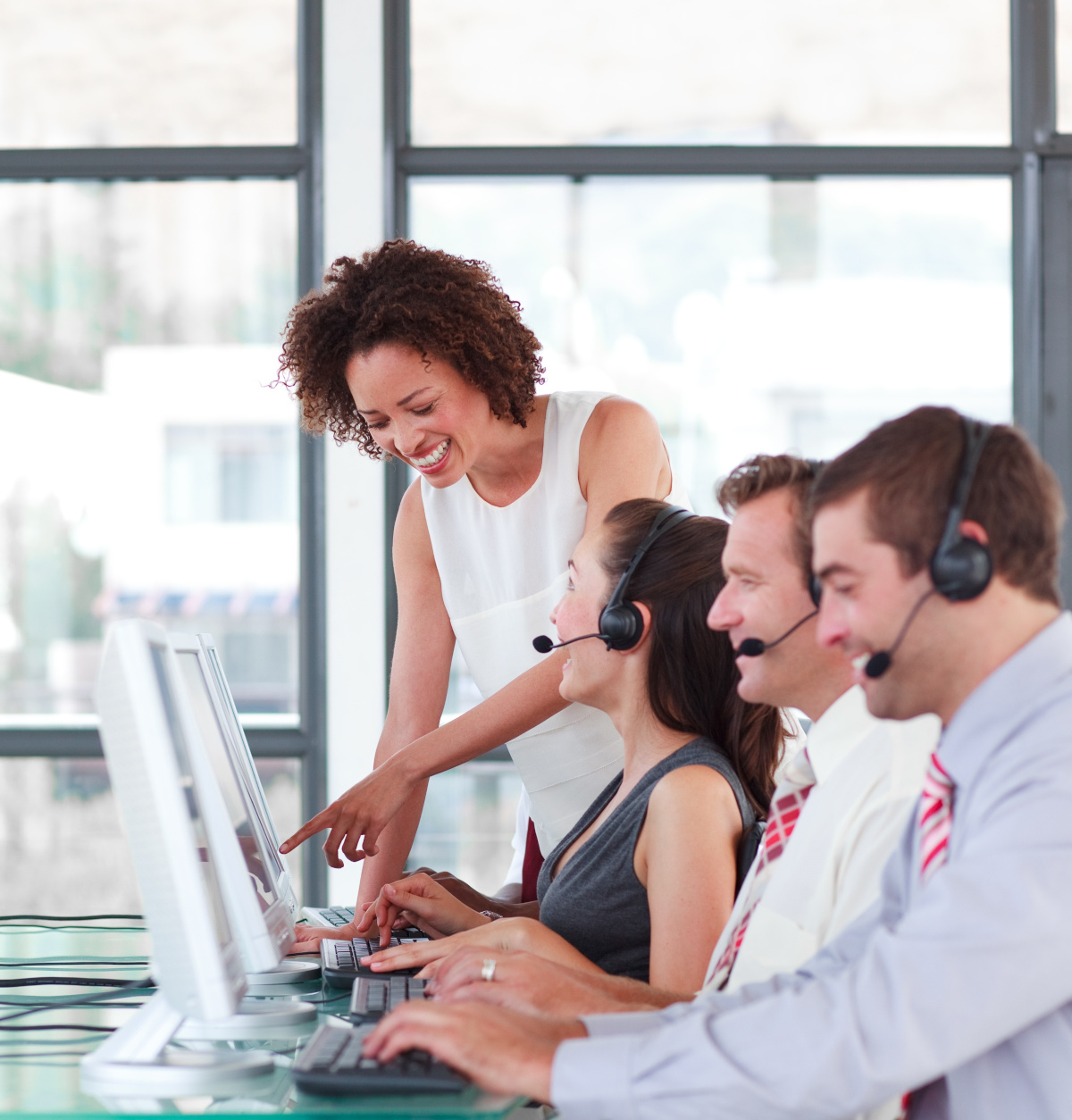 Contact Center employees working at their desks