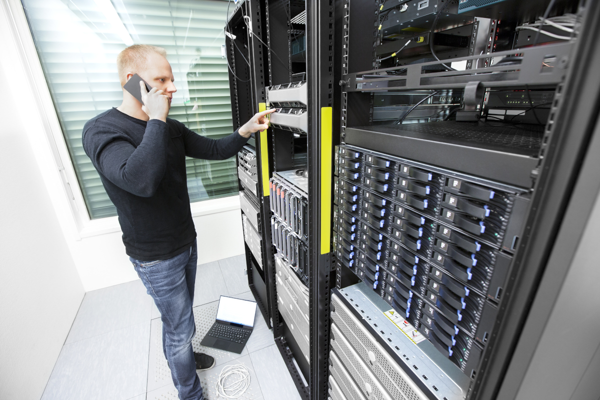 A person working on data storage hardware