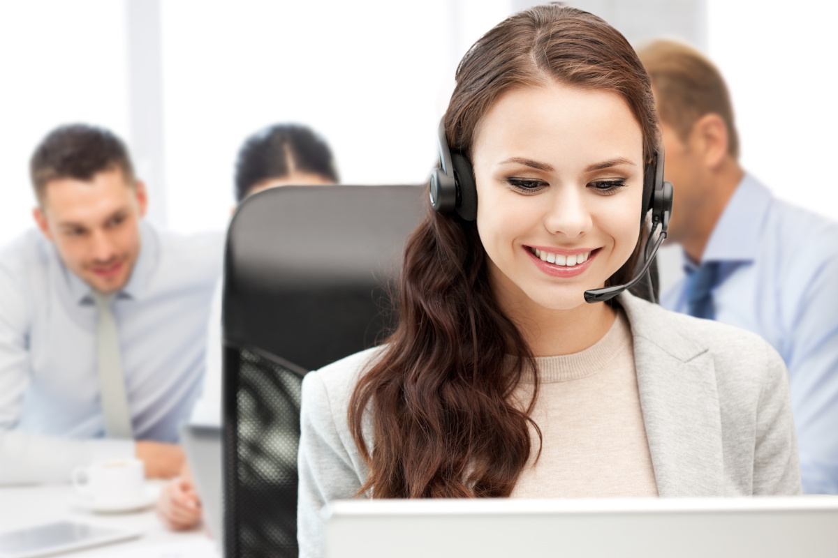 A smiling help desk employee