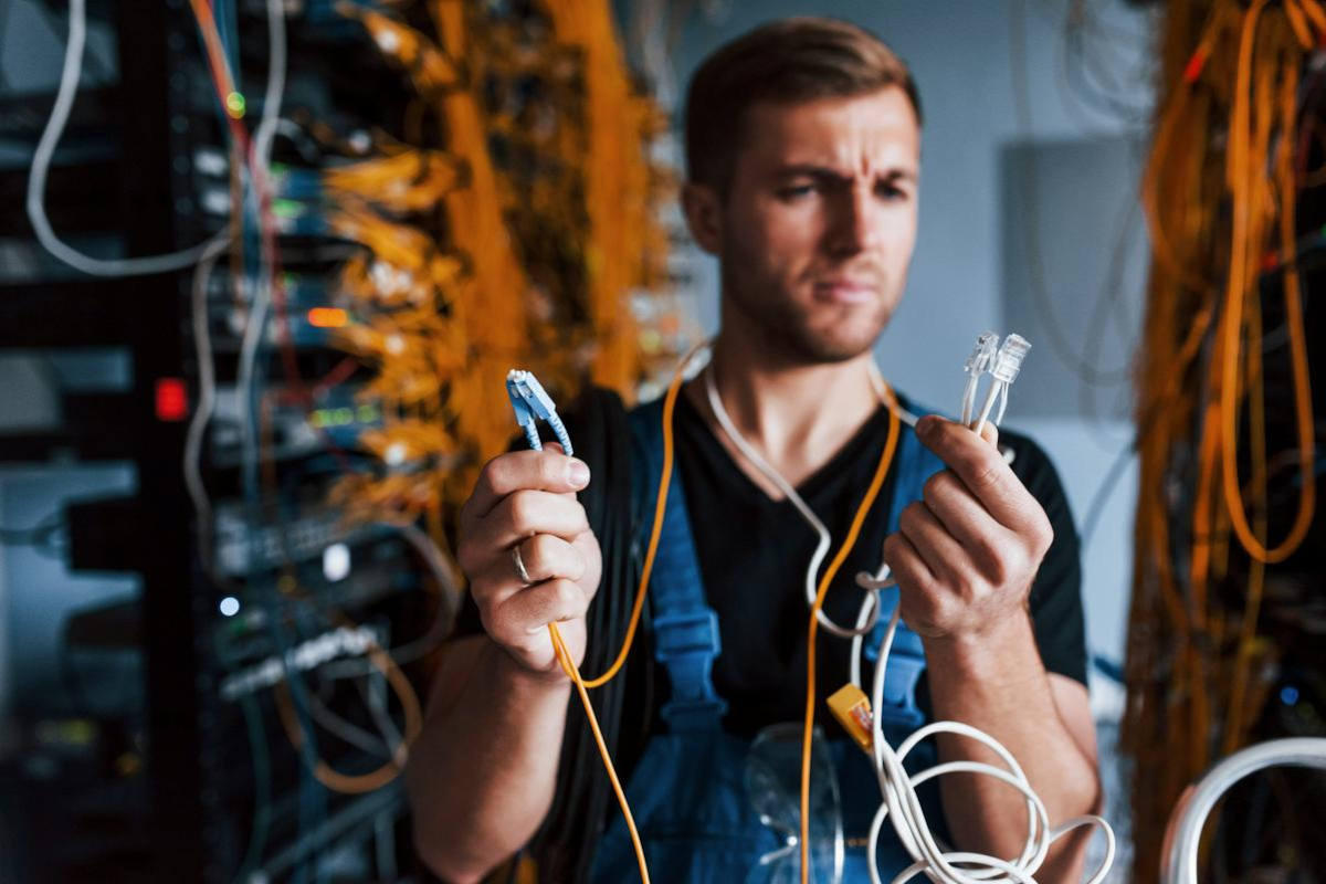 Network Technitian Working with Cables.