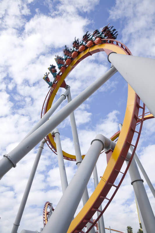 Loop of Hanging Roller Coaster with Car Upside Down on Track
